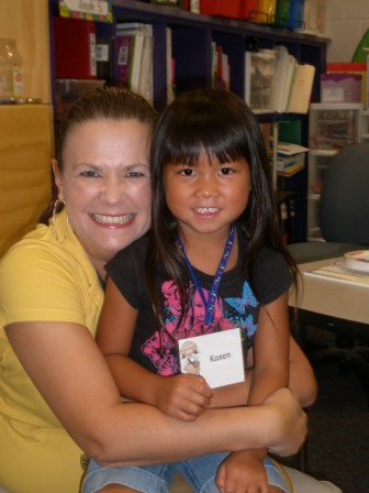 Kasen with her kindergarten teacher